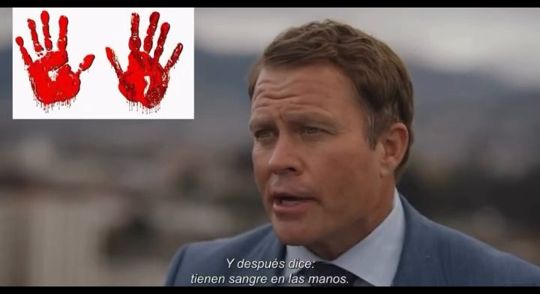 Same frame with bloody red handprints added